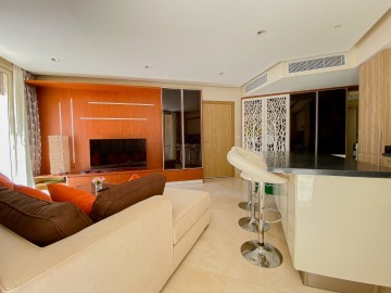 Living room with TV and bar counter