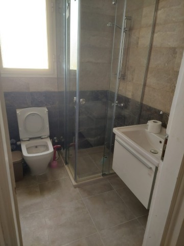 Bathroom with shower cabin between rooms - first floor