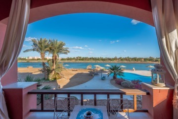 View from the balcony to the lagoon and pool