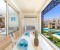 Large balcony with swing and dining table. Amazing pool view and ses side view.