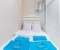 Small additional bedroom with bed and cupboard