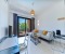 Cozy living room with a large sofa and a workplace for home office