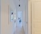 Beautiful hallway with mirror leading to the bedrooms.
