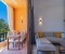 Balcony with seating area, dining table, and a view of the pool