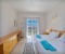 Bedroom 1 with work space and balcony with lagoon view