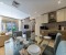Dining area, open kitchen and living room with balcony