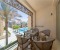 Balcony with table and chairs and nice view