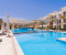 Pool with sunbeds and umbrellas 