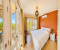 Bedroom with double bed and access to the balcony