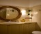Bathroom with large mirror and shower