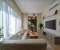 Living room with large smart TV and access to the terrrace and garden