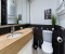 En-suite bathroom adjoining Bedroom 1, featuring a spacious shower and plenty of storage and counter space.