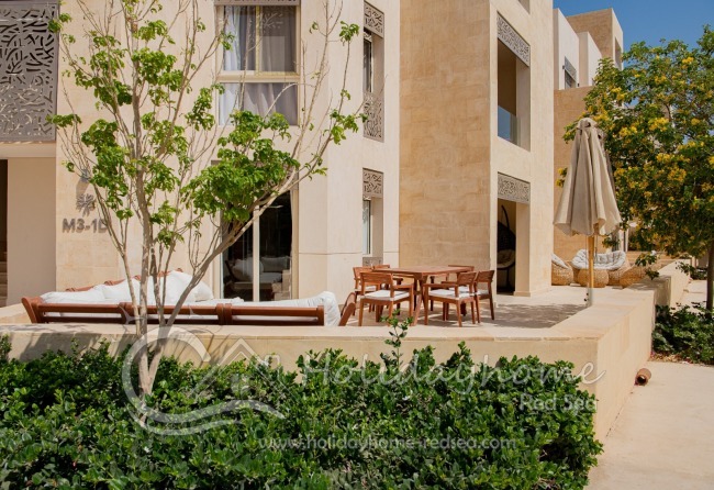Large terrace with two seating areas and dining table