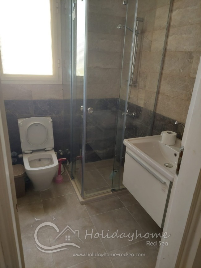 Bathroom with shower cabin between rooms - first floor