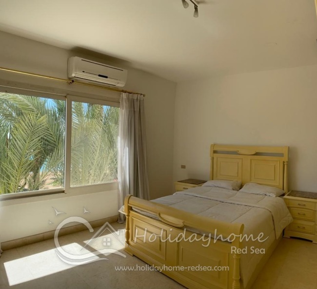 Bedroom 1 with double bed lagoon view
