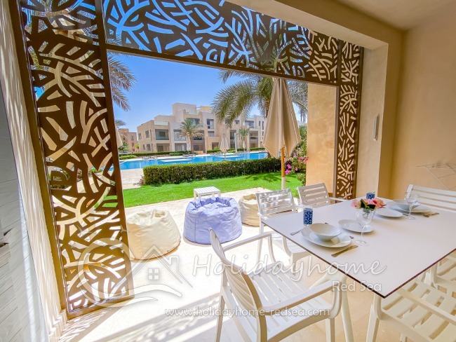 Terrace with sitting area and view to the pool