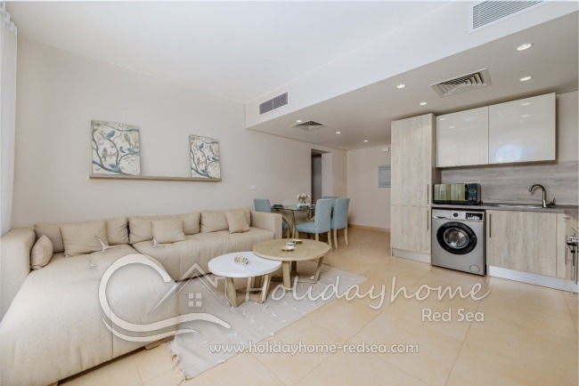 Fully equipped kitchen with stove, oven, fridge freezer, kettle, toaster, washing machine and microwave