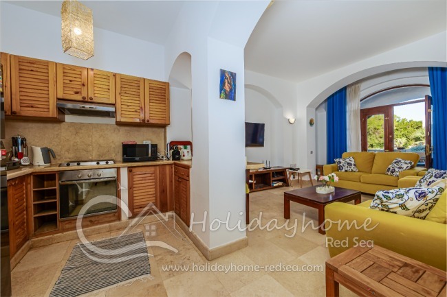 Spacious living room with TV