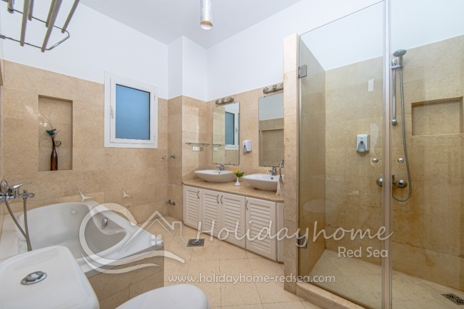 Bathroom with shower and bath tub to bedroom 2