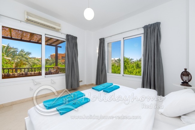 2. bedroom with large windows and terrace