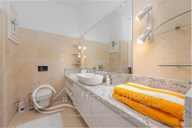 New renovated bathroom, with large counter top and mirror