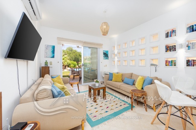 Living room with work space and kitchen counter