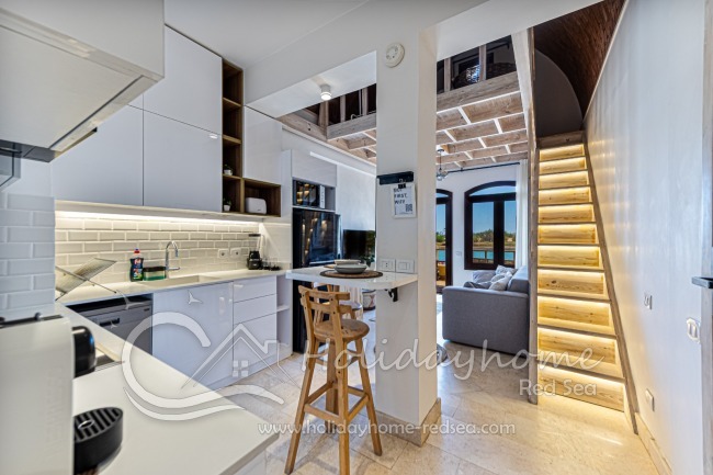 Modern apartment with open kitchen, living room and extra loft bed