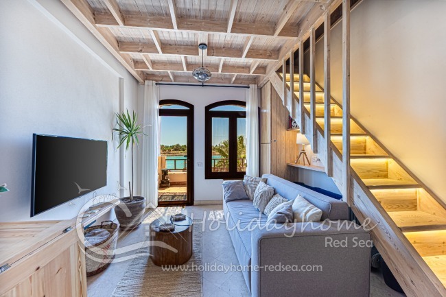 Bright living area with stairs to the extra loft bed