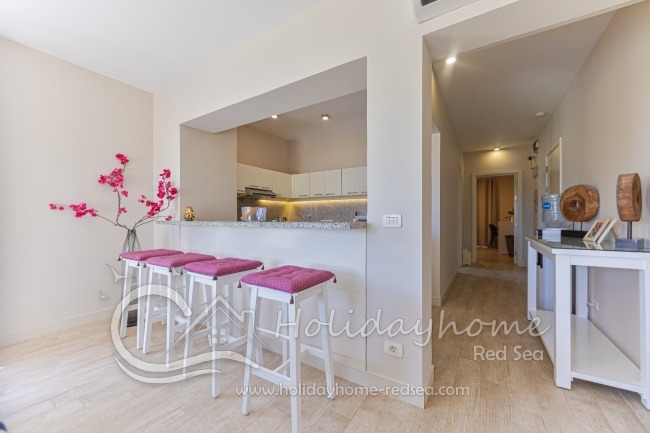 Kitchen with dining counter and corridor
