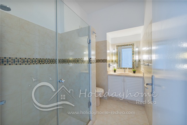 Bathroom to bedroom 2 with large shower