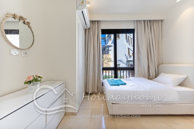 Second bedroom with 2 single beds, commode and wardrobe