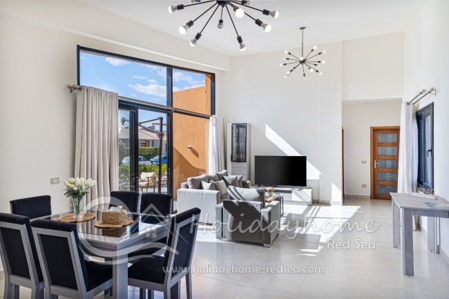 Bright, open living room with dining area