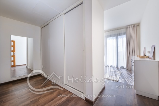 Master bedroom with large wardrobe and en-suite bathroom