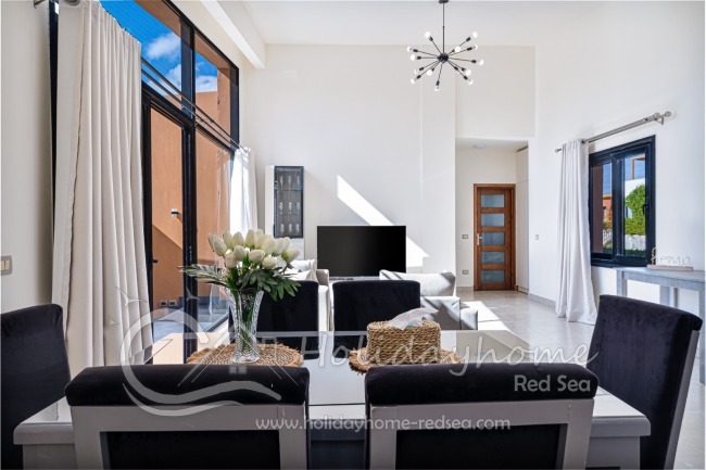 Dining table and spacious living room 