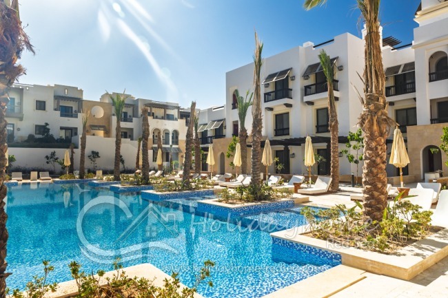 Large Pool with sunbeds and umbrellas