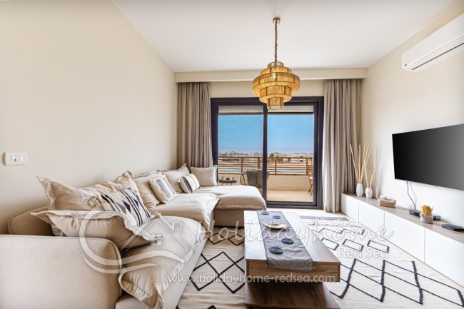 Bright, modern equipped living room with large, comfortable sofa