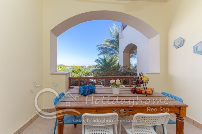 Large balcony with view to the garden and lagoon 