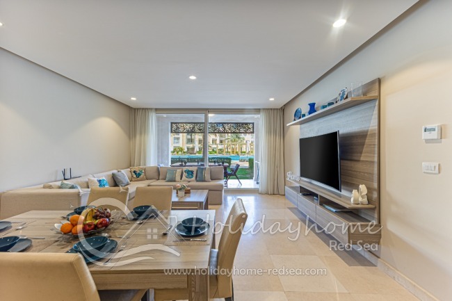 Living room with access to terrace and pool