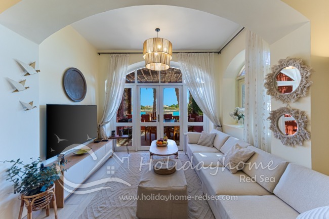 Livingroom with smart TV, access to the terrace and lagoon view