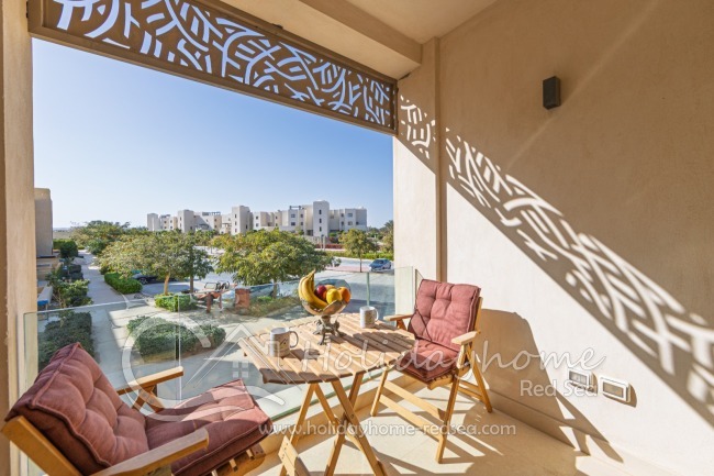 Balcony with sitting area and table