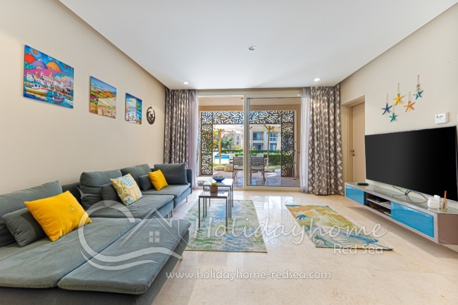 Living room with access to terrace and pool