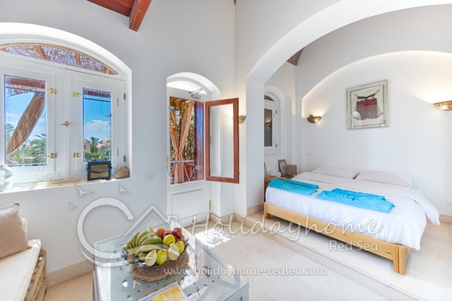 Comfortable bed in extra corner and wardrobe