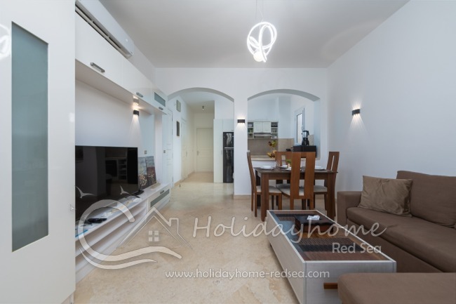 Living room with dining table and kitchen
