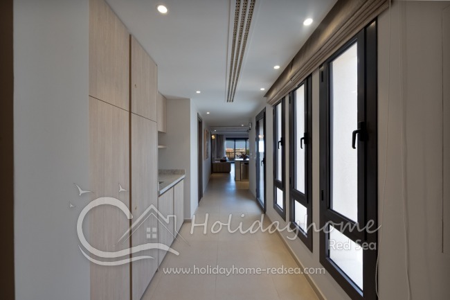 Hallway with a spacious built-in wardrobe and washing machine
