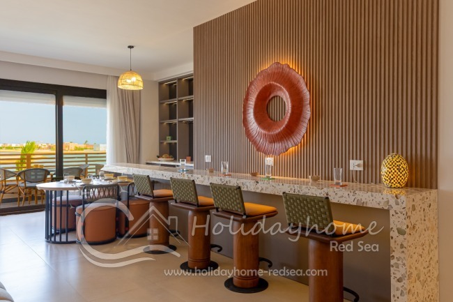 Bar with dining table and balcony view